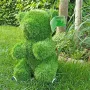 OURSON en gazon artificiel 38 cm sur une pelouse